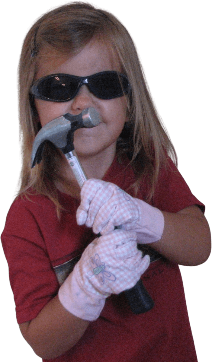 Annika as a kid, sunglasses on, hammer in hand